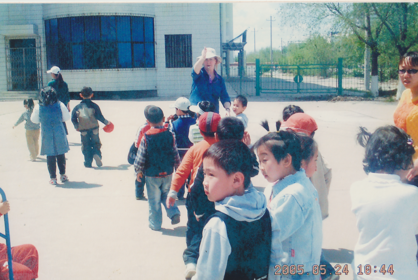 Children engaged in a classroom activity with a teacher
